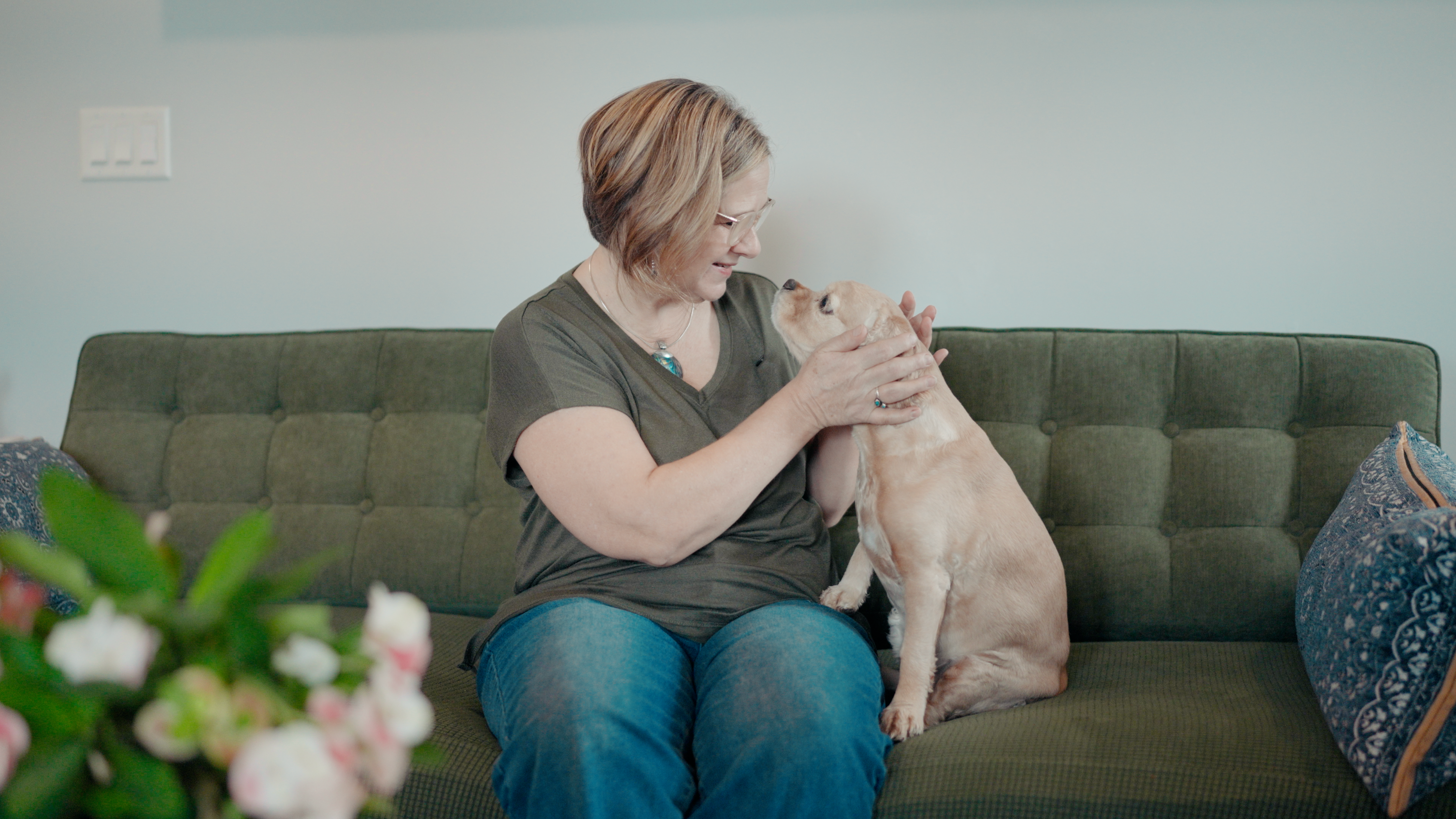 Woman with her dog on a couch