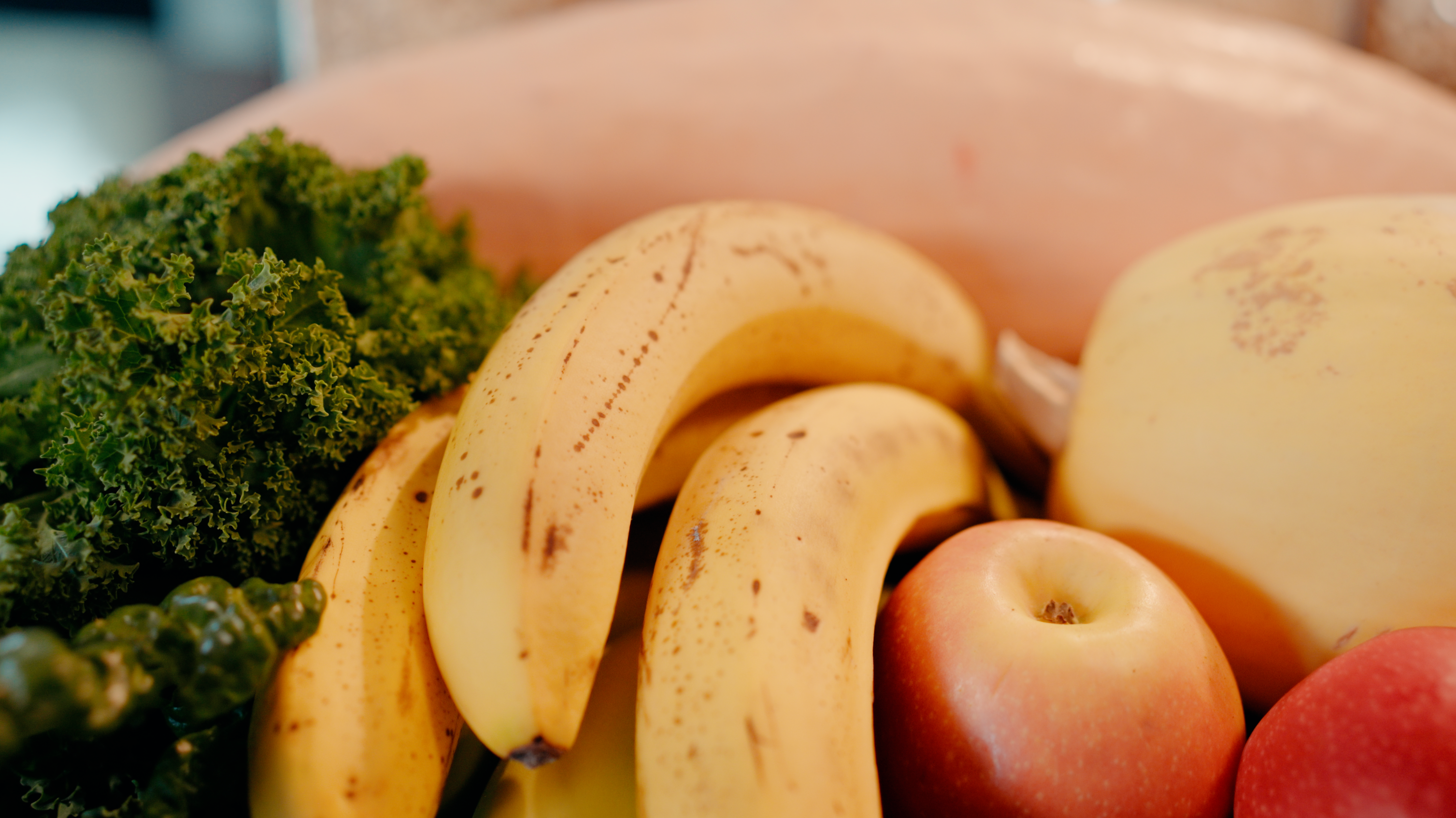 Fresh fruit and vegetables — bananas, apples, kale